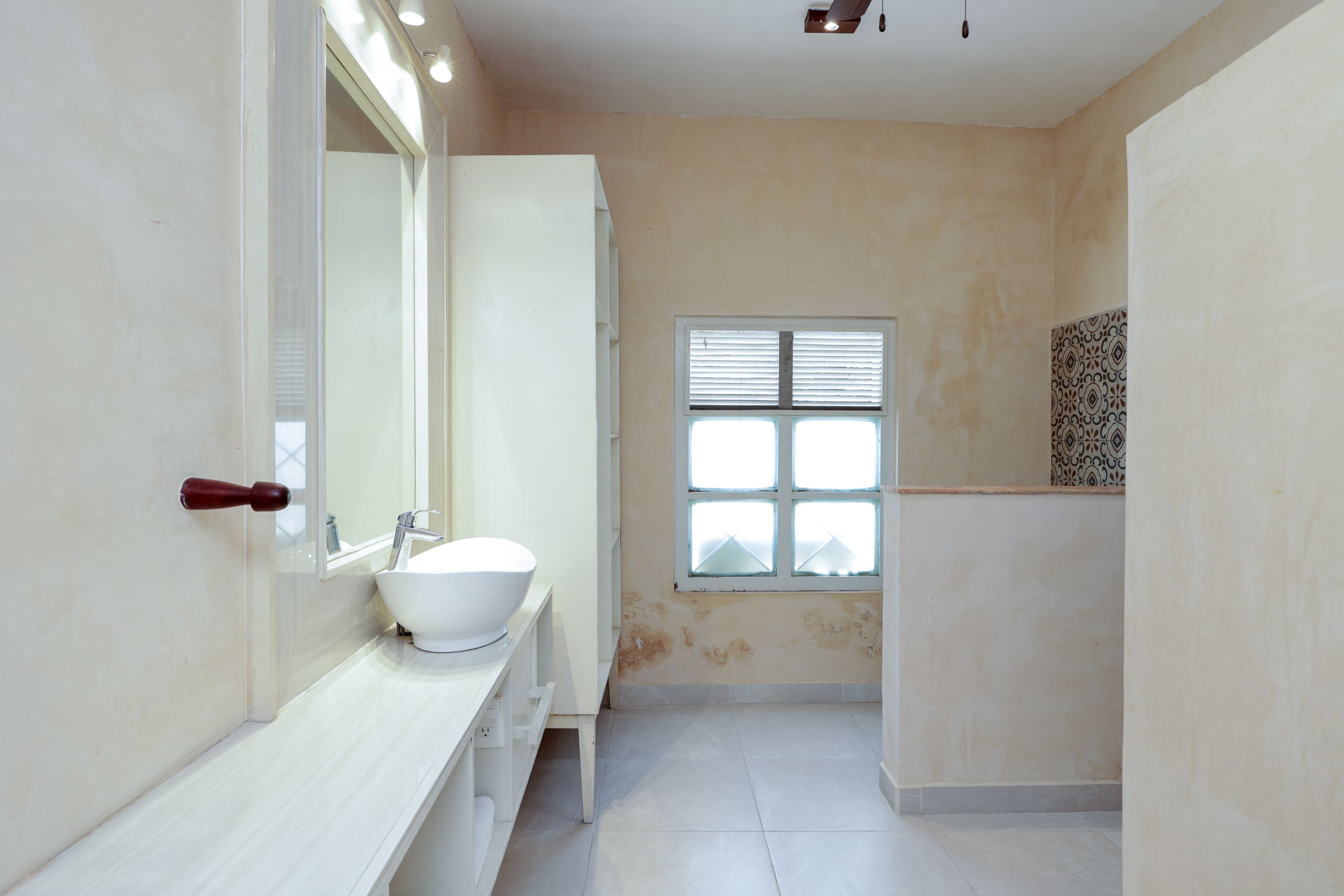 Minimalist beige bathroom with vessel sink