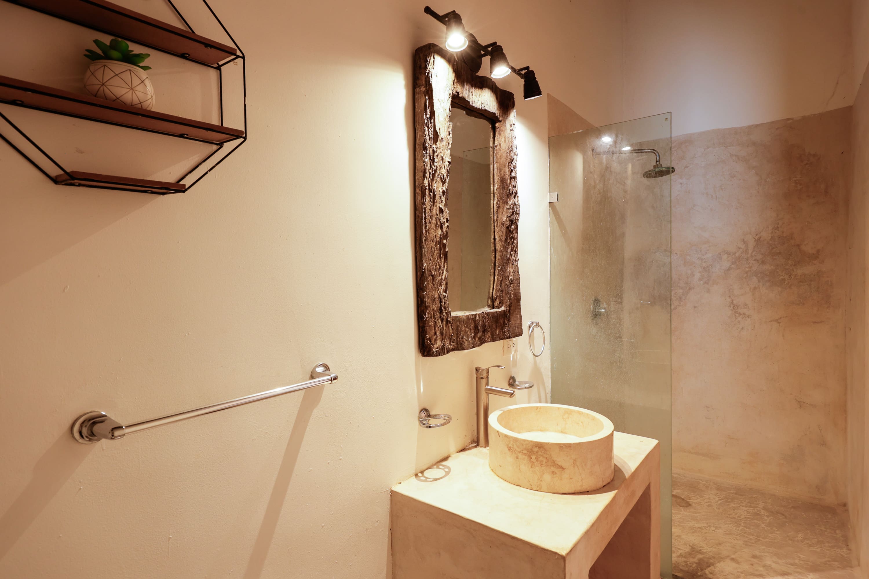Modern beige bathroom with stone vessel sink