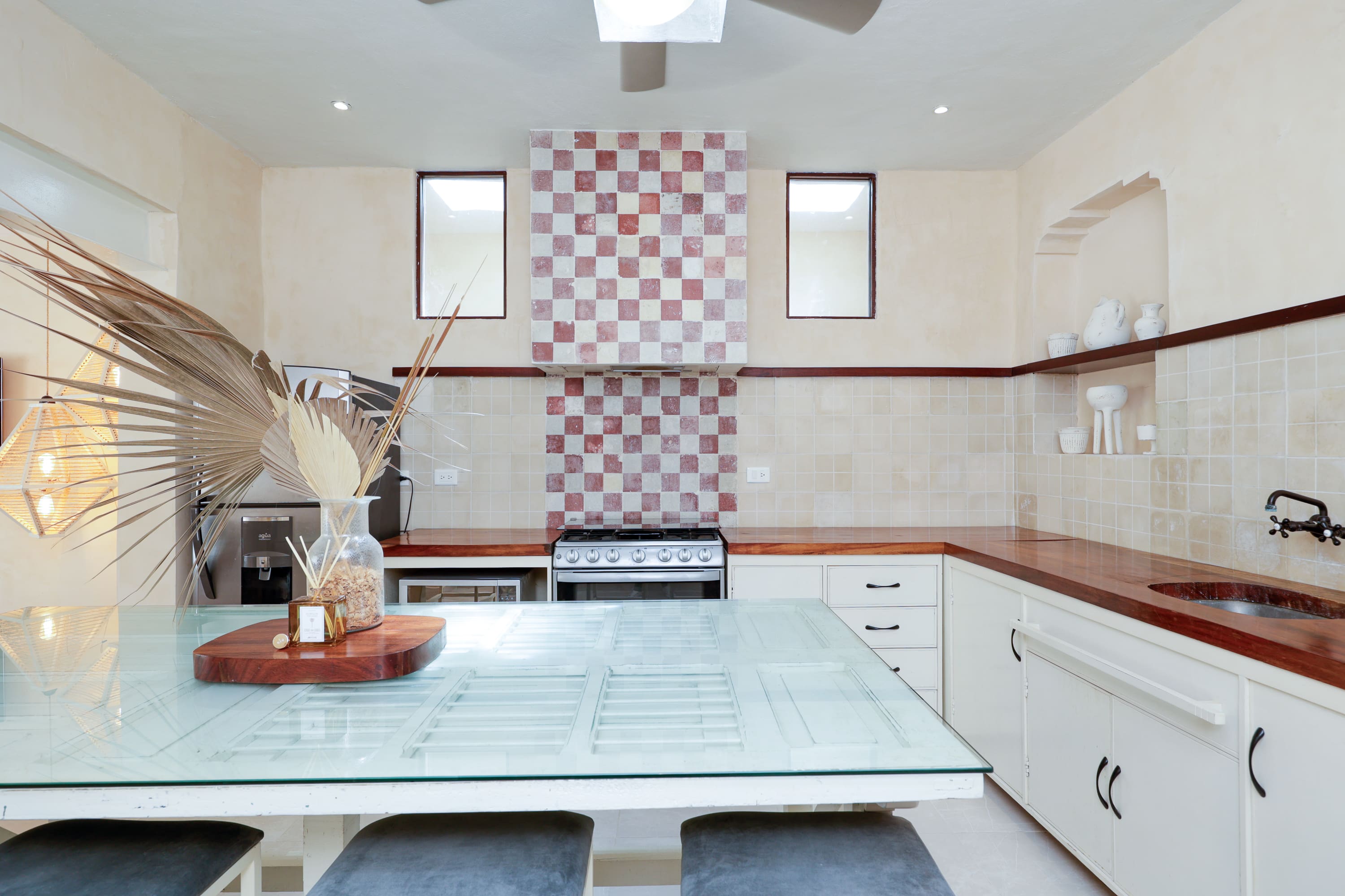Bright kitchen with checkered tile backsplash