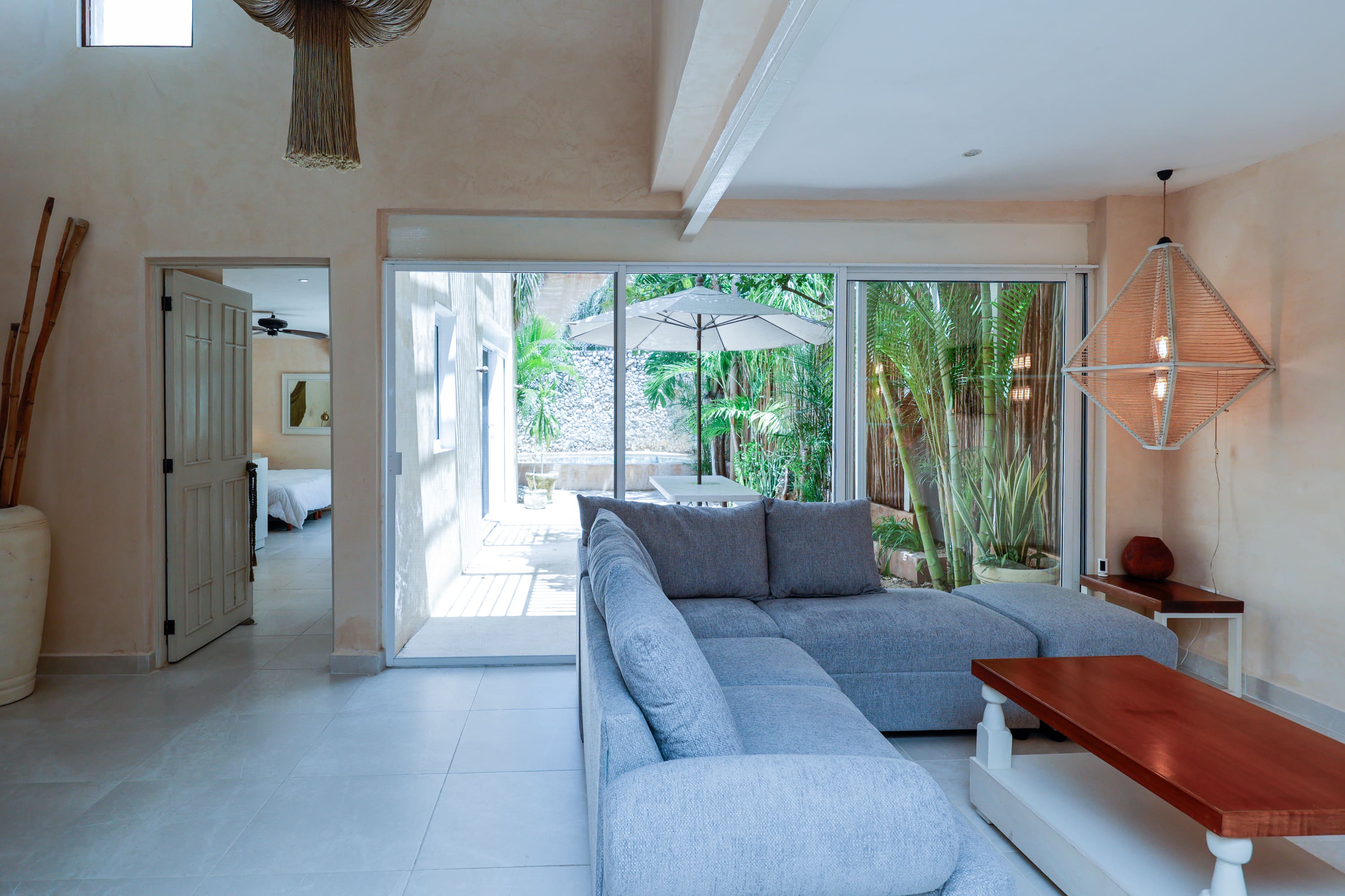 Modern living room with gray sectional and patio
