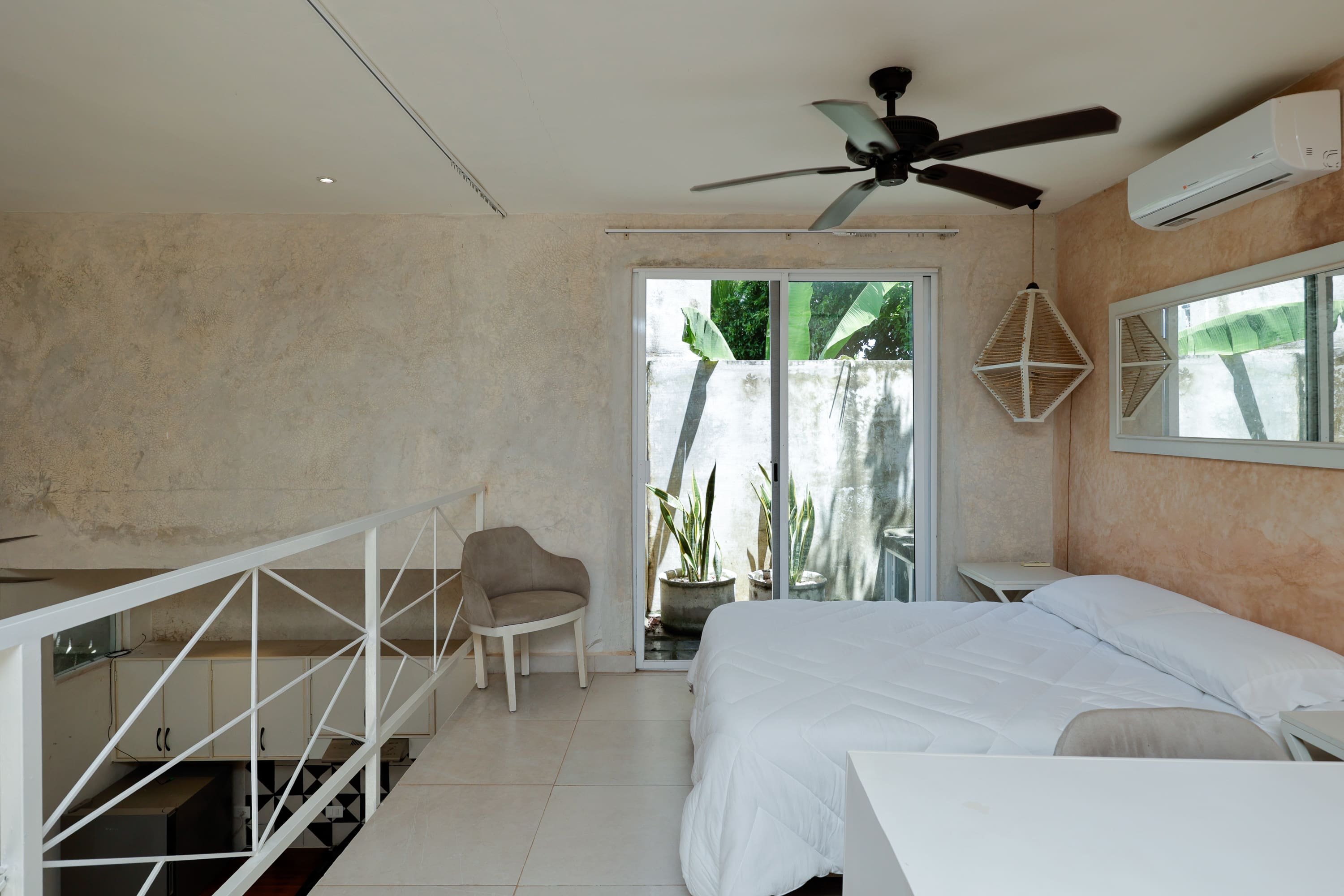 Modern bedroom with white bed and sliding doors