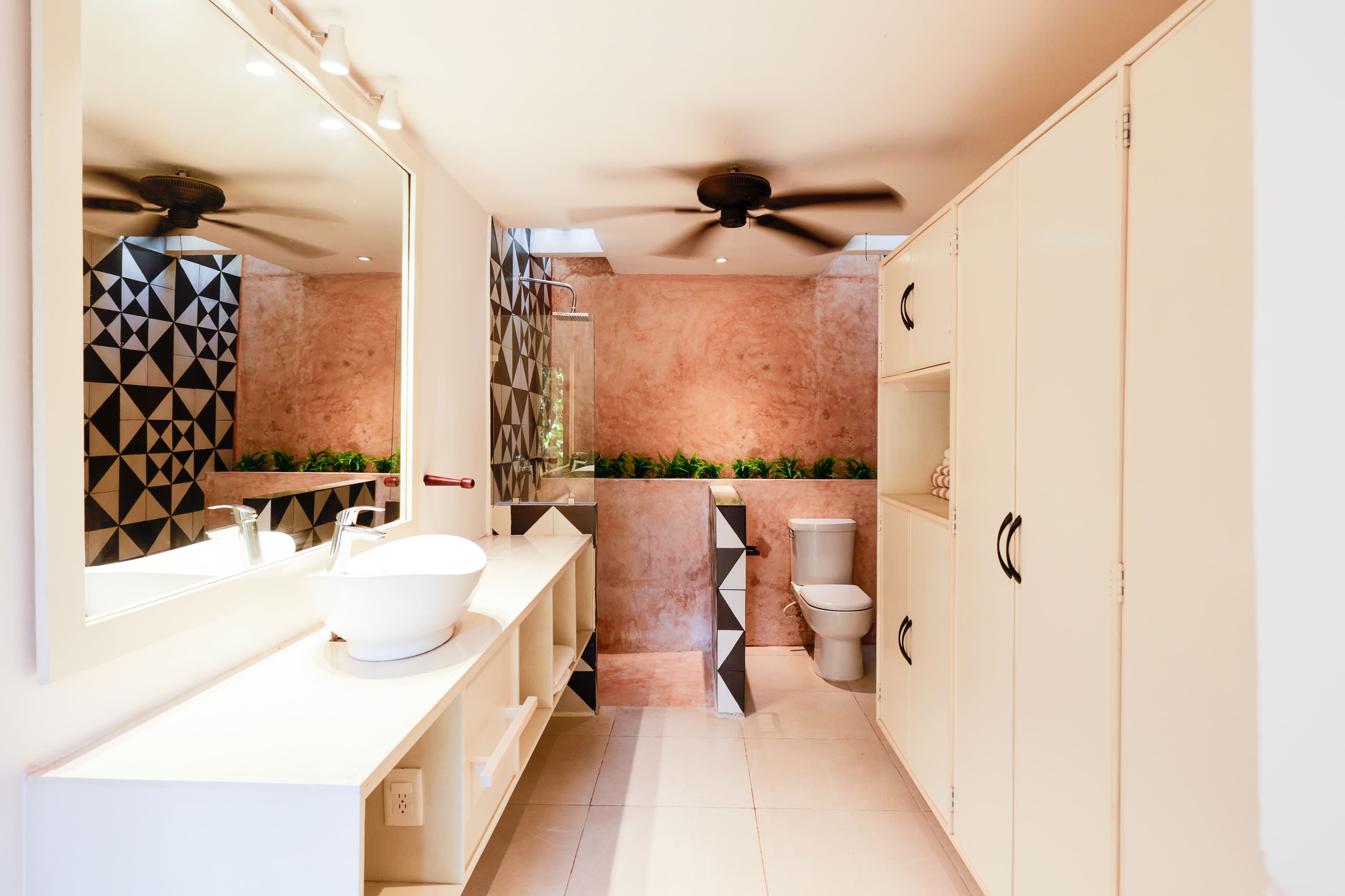 Modern bathroom with vessel sink and geometric tiles
